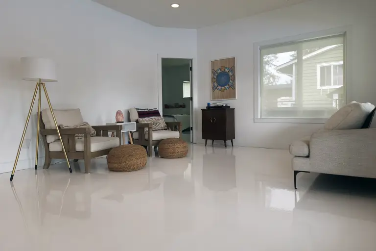 Solid colour high gloss white epoxy and polyaspartic floor coating in a home
